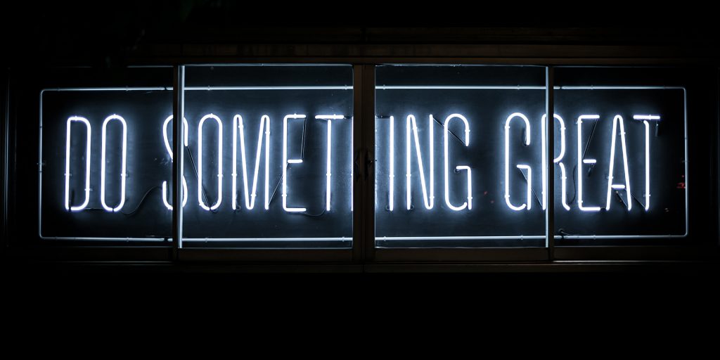Neon light sign that reads Do something great